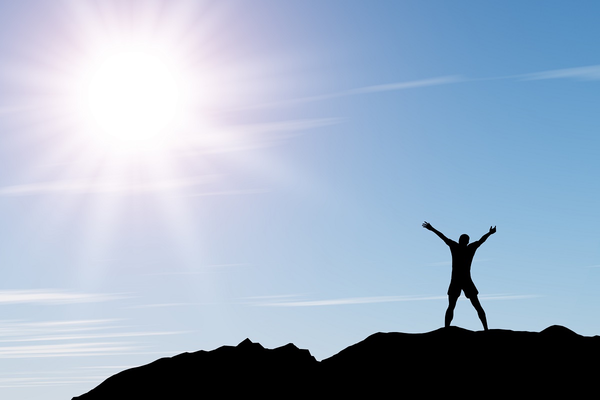 men greeting sun. Stands on hill, sunbeam and blue sky