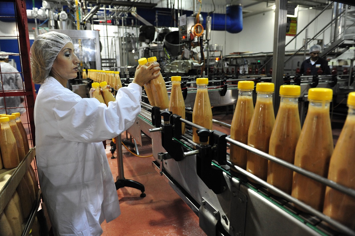 SDEROT, ISR - AUG 11:Production line worker in food factory on Aug 11 2009.Processed food sales worldwide are approximately US$3.2 trillion (2004)